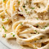 Fettuccine Alfredo · Sautéed fettuccine pasta with housemade alfredo sauce, shaved parmigiana cheese.