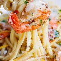 Jumbo Shrimp Scampi · Sautéed jumbo shrimp in garlic white wine sauce on a bed of angel hair pasta.