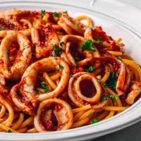 Calamari Fra Diavolo · Tender calamari sautéed in spicy marinara sauce on a bed of linguine.