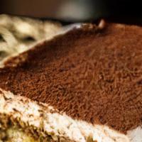 Homemade Tiramisu · Made with marscapone and lady fingers dipped in espresso coffee, dusted with cocoa powder.