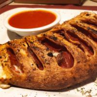 Meat Calzone (Large) · Meatballs, Italian sausage, pepperoni, ricotta
cheese, mozzarella cheese.