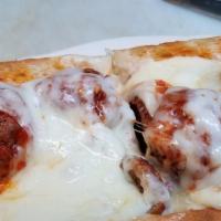 Meatball Parmigiana Sub · Beef and pork meatballs with Sunday sauce, mozzarella cheese.