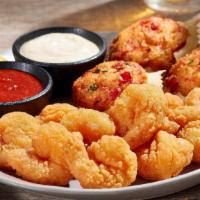 Shrimp & Stuffed Crab Appetizer* · Tender, crispy popcorn shrimp and tasty stuffed crab.