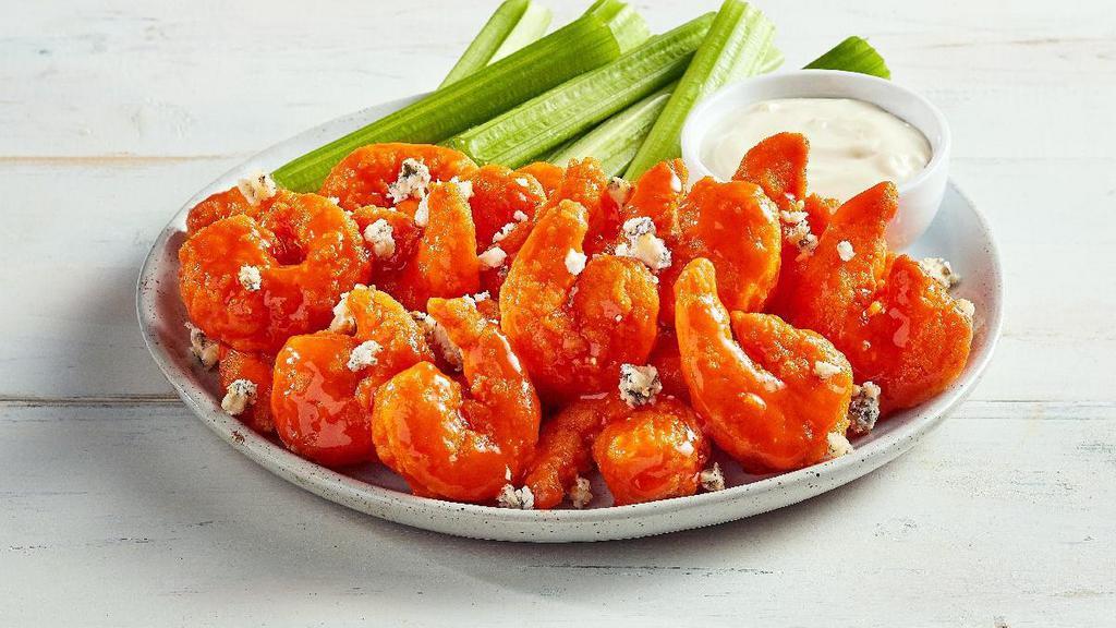 New! Buffalo Shrimp · Bite-size shrimp fried until golden brown and crispy, tossed in our spicy Buffalo sauce and topped with bleu cheese crumbles. Served with celery sticks and bleu cheese dressing.
