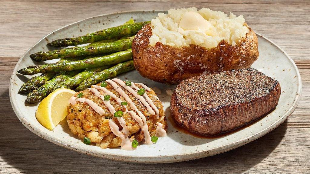 Steak & Crab Cake (Crab, That Is)* · A 6-oz. USDA Choice sirloin steak paired with a pan-seared lump crabmeat cake drizzled with lemon sauce, topped with sliced green onion. Served with choice of two sides.