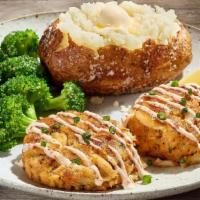 The Crab Cake Dinner* · Two pan-seared lump crabmeat cakes drizzled with our tangy lemon sauce, topped with sliced g...