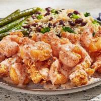 Bayou Tenders · O’Charley’s Famous Chicken Tenders smothered in a Cajun Shrimp sauce and crispy popcorn shri...