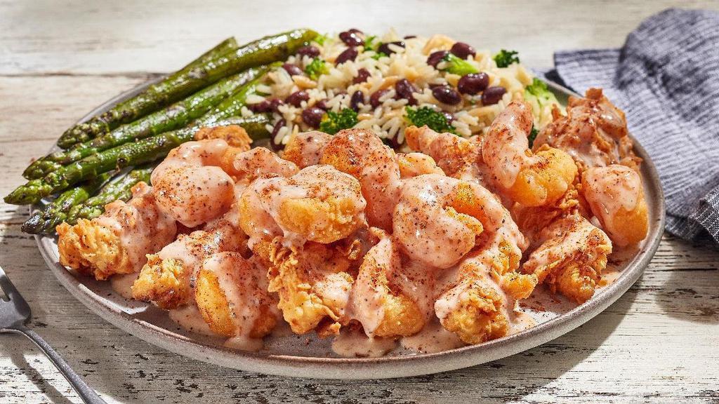 Bayou Tenders · O’Charley’s Famous Chicken Tenders smothered in a Cajun Shrimp sauce and crispy popcorn shrimp, dusted with special Cajun seasonings. Served with choice of two sides.