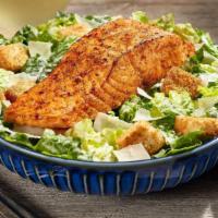 Salmon Caesar* · Our 6-oz. perfectly grilled salmon sprinkled with our special herb seasoning, served on a be...
