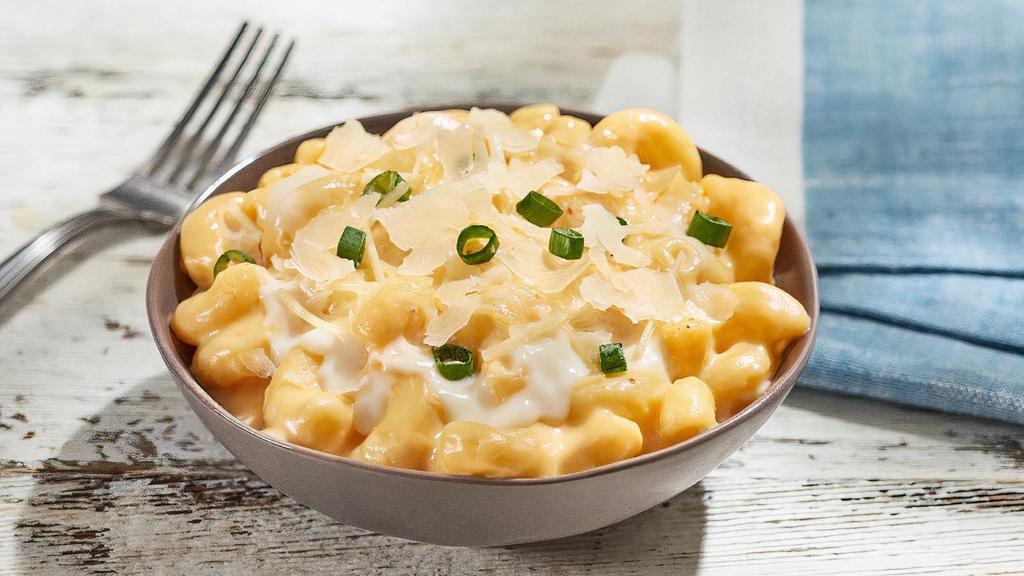 Loaded Mac & Cheese (Premium Side) · Creamy mac & cheese mixed with alfredo sauce, three-cheese blend, parmesan cheese, and topped with diced green onion.