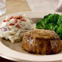 Filet Mignon With Garlic Butter* · Our most tender and juicy steak, a 7-oz. center-cut filet mignon is topped with garlic butte...