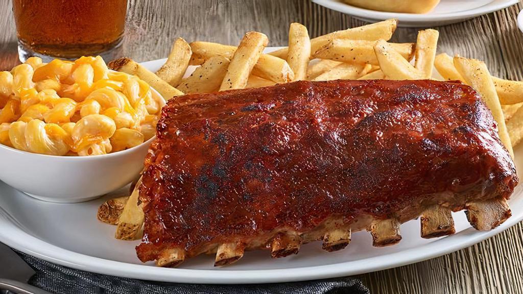 Baby Back Ribs · Hand-rubbed with seasonings. Also available Nashville Hot or Carolina Gold BBQ Sauce. Served with two sides.
