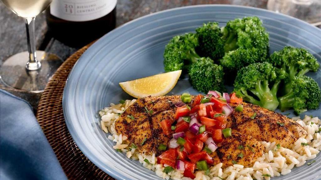 Santa Fe Tilapia · Grilled and topped with house-made Pico de Gallo. Served atop rice pilaf with broccoli.