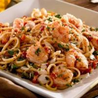 Garlic Shrimp Pasta · Sauteed in crushed tomato and garlic sauce with linguini and topped with parmesan cheese and...