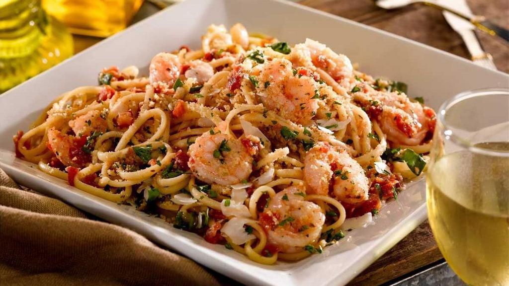 Garlic Shrimp Pasta · Sauteed in crushed tomato and garlic sauce with linguini and topped with parmesan cheese and toasted bread crumbs.