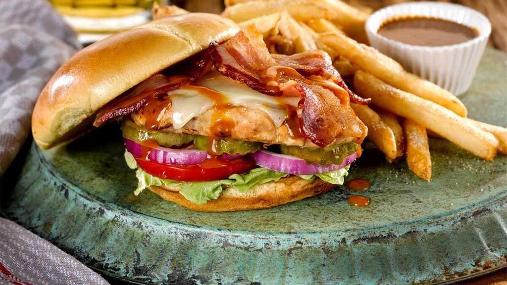 Carolina Gold Bbq Chicken Sandwich · Grilled chicken breast, applewood-smoked bacon, Monterey Jack cheese, Carolina Gold BBQ Sauce with lettuce, tomato, onion and pickles. Served with fries.