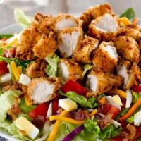 Southern-Fried Chicken Tender Salad · With tomatoes, hard-boiled eggs, bacon and cheddar cheese with our Honey Mustard Dressing.