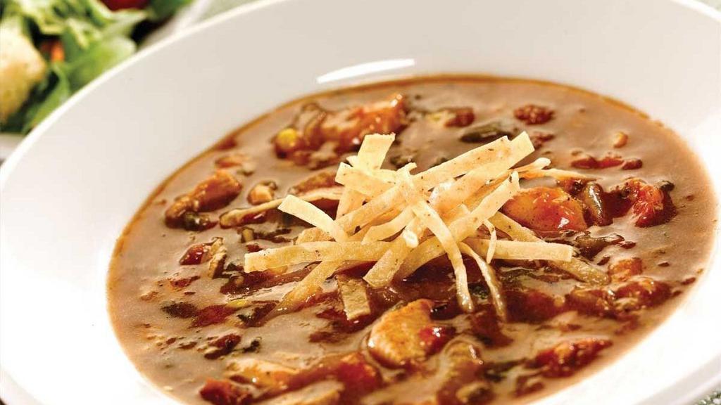 Chicken Tortilla Soup · Zesty, spicy soup with chicken, green Chile peppers, tomatoes, ground tortillas and cumin. .