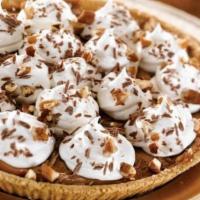 Whole Ooey Gooey Caramel Pie · Creamy caramel in a graham cracker crust topped with whipped cream, chocolate morsels and pe...