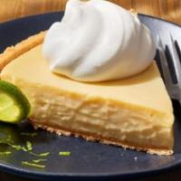 Key Lime Pie - Slice · Tangy, creamy, smooth and the perfect ending to a great meal. This pie comes in a graham cra...