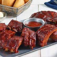Baby Back Ribs Platter · Three full racks of Baby Back Ribs, hand-rubbed with brown sugar and secret spices and slow-...