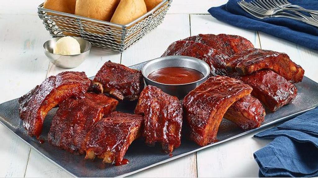Baby Back Ribs Platter · Three full racks of Baby Back Ribs, hand-rubbed with brown sugar and secret spices and slow-cooked till they're fall-off-the-bone tender.  Available sauced with Original BBQ, Nashville Hot or Carolina Gold BBQ.