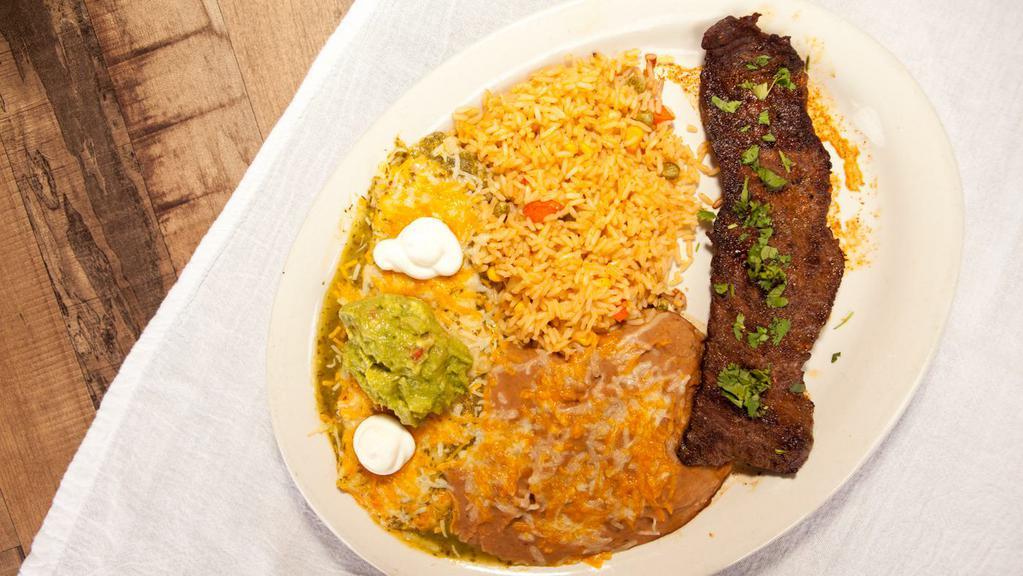 Carne Asada · Gluten free. A skirt steak blackened Mexican style and served with enchilada verde. Topped with sour cream and guacamole. Served with Mexican rice and refried beans.
