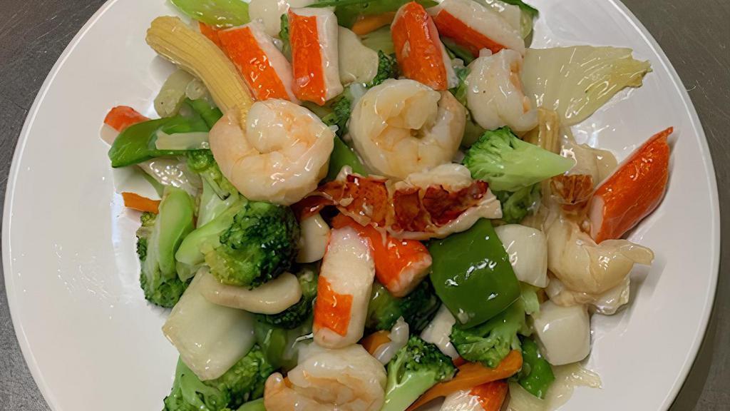 Seafood Delight · Lobster meat, jumbo shrimp, scallops, and crab meat sautéed with assorted mixed vegetables in a special white sauce. Served with white rice.