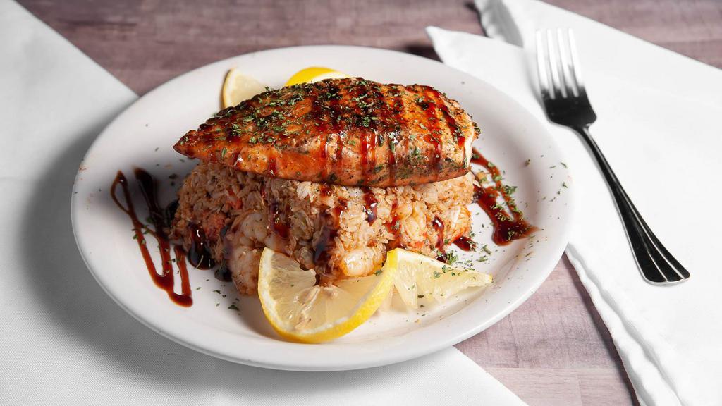Salmon & Seafood Rice · Jasmine rice molded with shrimp and lump crab meat topped with blackened salmon.