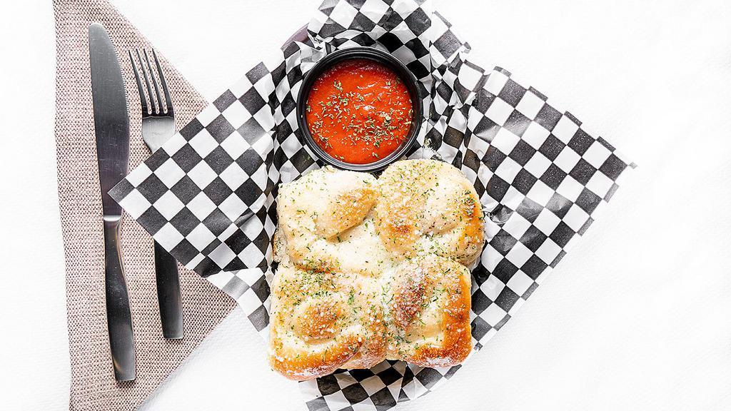 Garlic Knots · Vegetarian delights. Freshly baked and brushed with garlic, sesame seeds, and Romano cheese. Served with marinara sauce. 6 knots.