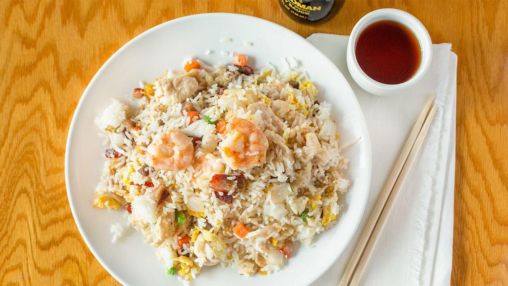 Young Chow Fried Rice · Perdue Chicken, Roast Pork  and Atlantic Shrimp. Woked with onions, carrots, peas and bean spouts.