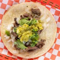 Steak Taco · Outter Skirt Steak seasoned to perfection . 
Topped with Onions Cilantro and Homemade Salsa ...