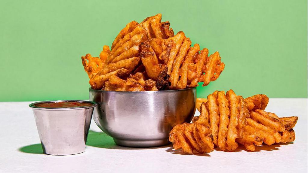 Waffle Fries · crispy waffle fries served with a side of truffle ketchup