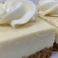 Cheesecake Cloud · A buttery cookie crust topped with a silky, rich vanilla cheesecake cream and crumbles on top.