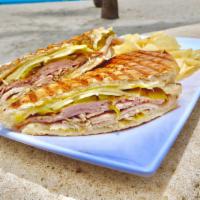 The Cubano · Sliced roast pork, ham and Swiss cheese with dill pickles and yellow mustard.
