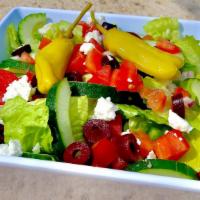 Greek Salad · Romaine lettuce, tomatoes, bell peppers, cucumbers, red onions, feta cheese & Kalamata olive...