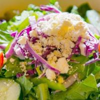 Greek Salad  · Fresh romaine lettuce sprinkled with feta cheese, garden fresh vegetables and our house bals...