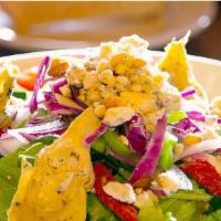 Mediterranean Salad  · Romaine lettuce, fresh garden vegetables, pine nuts, sun-dried tomatoes, artichoke hearts an...