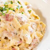 Pappardelle Carbonara · Thinly sliced prosciutto di arma, garlic and red onions, in a romano cream sauce and italian...