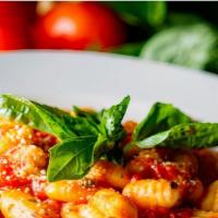 Gnocchi · Homemade potato pasta, fresh basil and served with choice of Russo’s marinara, chianti-brais...