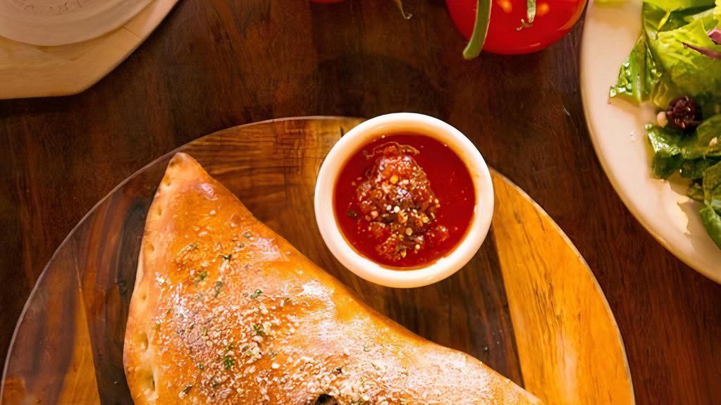 Create Your Own Calzone · Up to three toppings of your choice. We'll add the mozzarella.