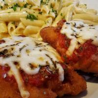 Chicken Parmigiana · Breaded chicken breast topped with our homemade tomato sauce, mozzarella and oregano. Served...