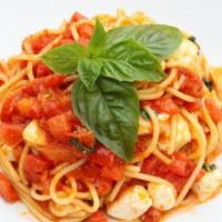 Spaghetti Crudaiola · Tomato sauce, diced tomatoes, mozzarella fior di latte, fresh basil.