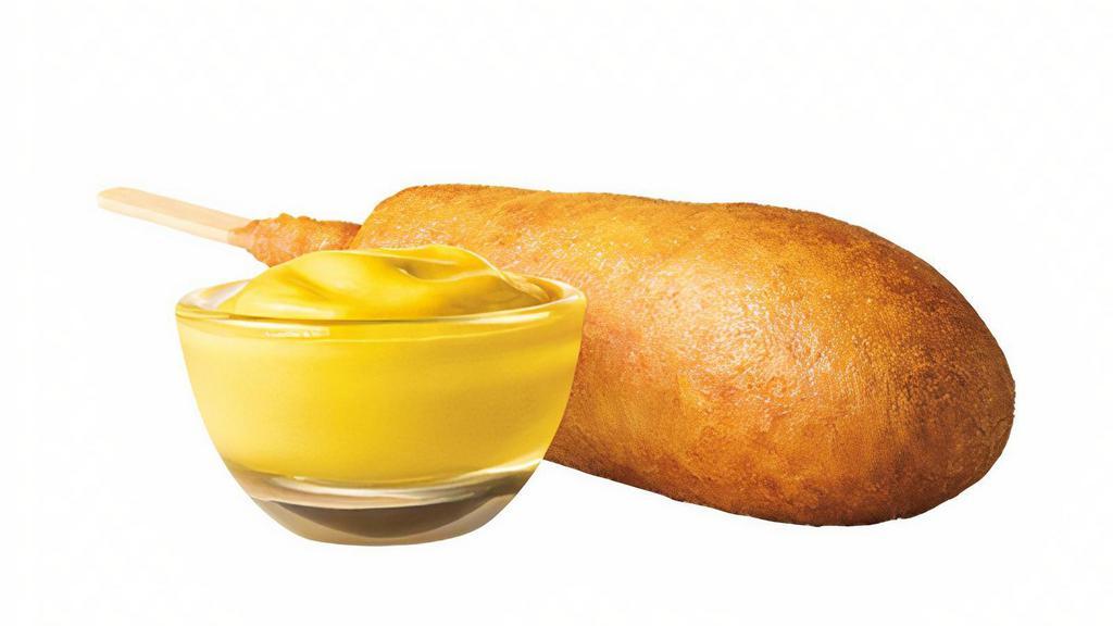 Corn Dog · Simple food at its finest. A delicious hot dog surrounded in sweet corn batter and fried to a crispy golden brown. It's like hot dog utopia on a stick.