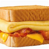 Bacon Breakfast Toaster® · Behold – melty cheese, crispy bacon all stacked up on thick Texas Toast and served with fluf...