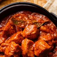 Chicken Tikka Masala · Chicken breast grilled in tandoor and cooked in creamy sauce with green bell peppers.