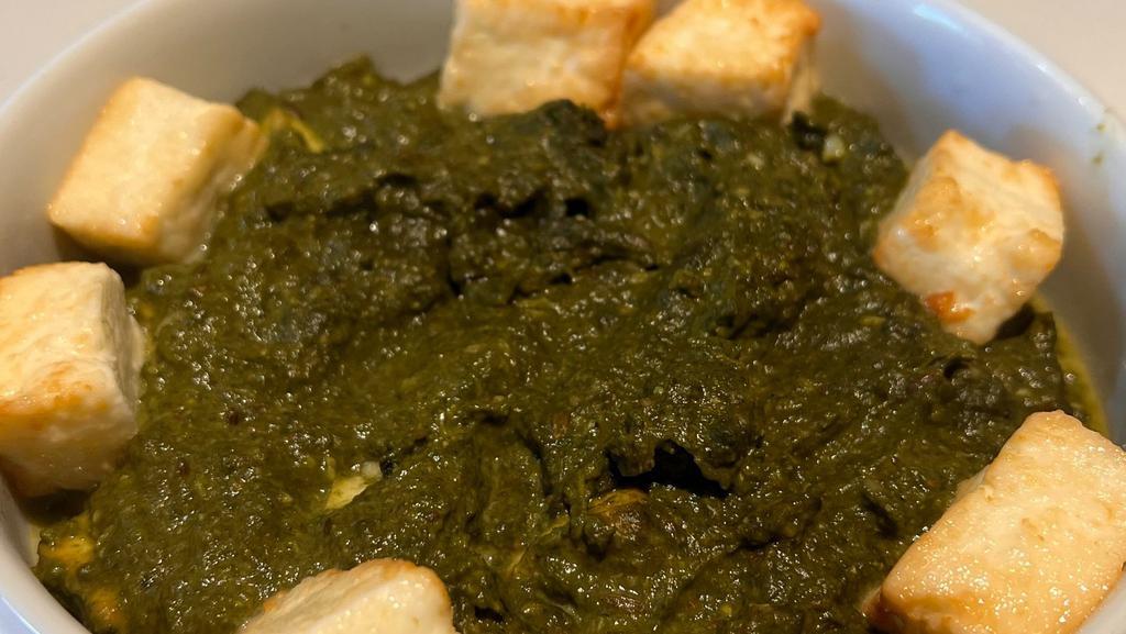 Palak Paneer · Garden fresh spinach cooked with homemade cheese cubes & spices.