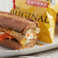 Pesto Chicken · All-natural chicken, red and yellow bell peppers, Swiss, basil pesto on 11-grain bread.