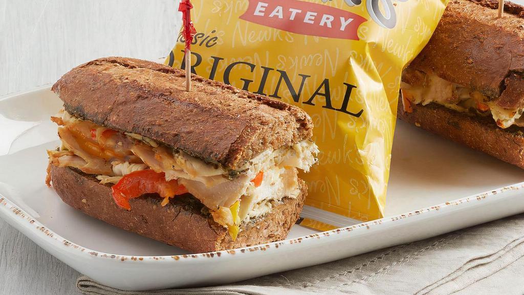 Pesto Chicken · All-natural chicken, red and yellow bell peppers, Swiss, basil pesto on 11-grain bread.