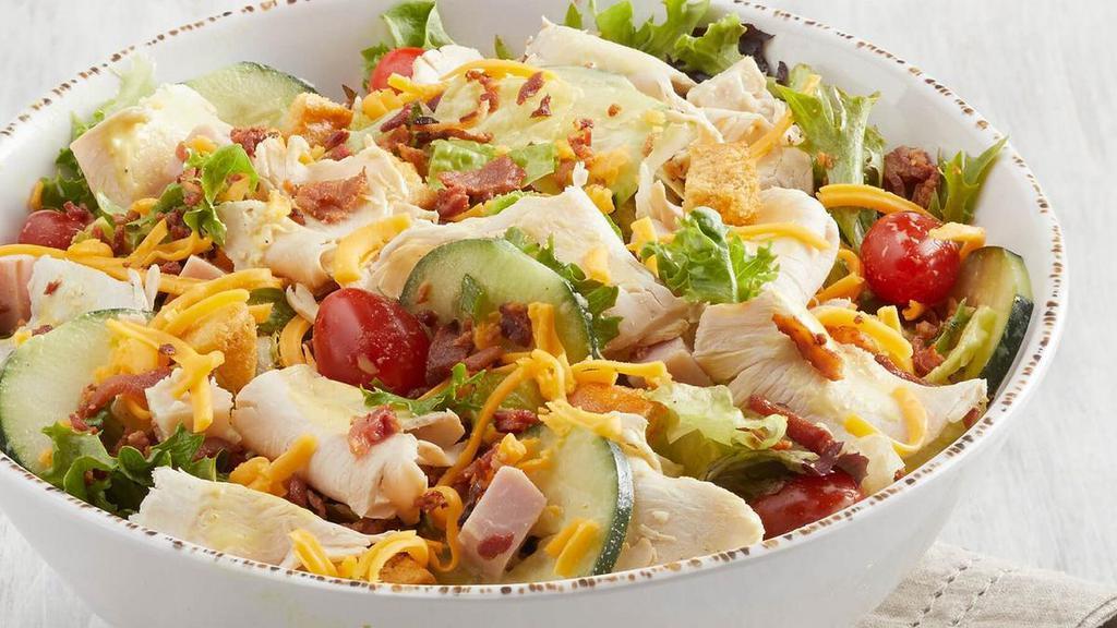 Ultimate (P) · All-natural chicken, bacon, ham, turkey, mixed greens,. grape tomatoes, cucumbers, cheddar, croutons. Served with Honey Mustard dressing. Adds 330 cal